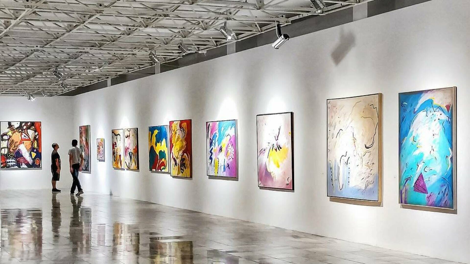 art gallery with white walls and concrete floors.